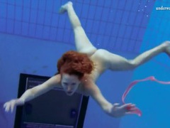 Find-Best-Hardcore.com presents: Curly hair redhead swims and looks sexy